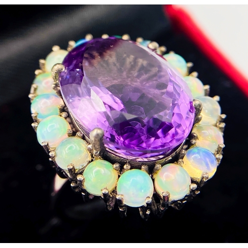 507 - A Brazilian Amethyst & Ethiopian Fire Opal Ring! Set in 925 silver. A 21ct amethyst with an opal sur... 