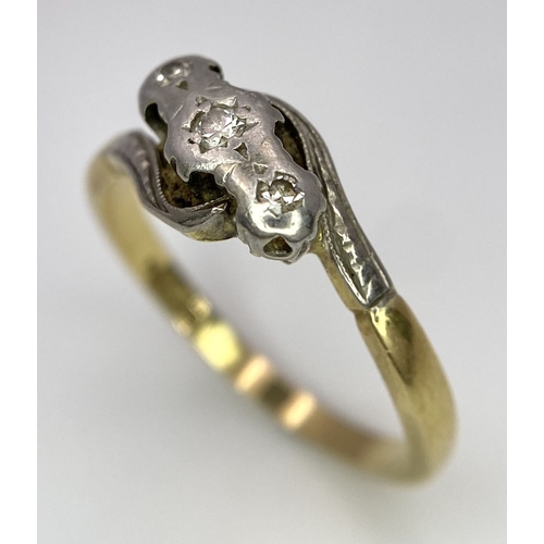 65 - A Vintage 18K Yellow Gold, Platinum and Old Cut Diamond Crossover Ring. Three old cut gypsy-set diam... 