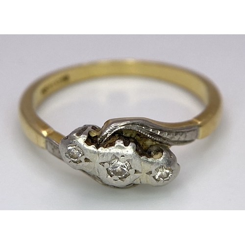 65 - A Vintage 18K Yellow Gold, Platinum and Old Cut Diamond Crossover Ring. Three old cut gypsy-set diam... 