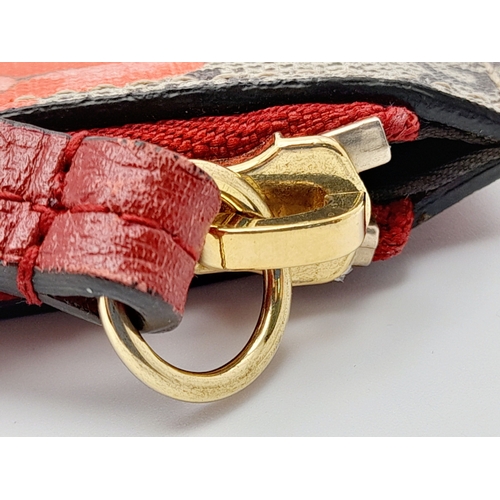 95 - A Gucci Monogram 'Tian' Clutch Bag. Leather exterior with a depiction of a bird in nature, red leath... 