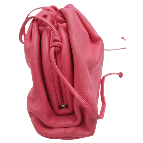 108 - A Bottega Veneta Pink Mini Pouch Bag. Leather exterior with thin strap and magnetic closure. Pink le... 