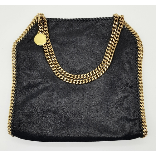 122 - A Stella McCartney Black Falabella Shoulder/Tote Bag. Faux suede exterior with gold-toned heavy hard... 