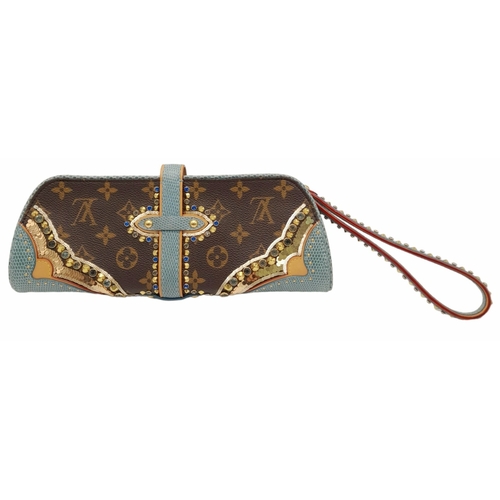 13 - A Louis Vuitton Monogram Les Extraordinaires Clutch Bag. Leather exterior with stone and stud embell... 