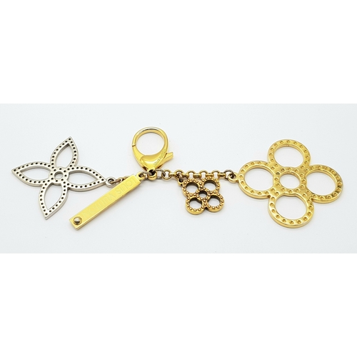 171 - A Louis Vuitton Bijoux Sac Tapage Charm/Key Ring. Gold and silver-toned hardware with iconic LV shap... 