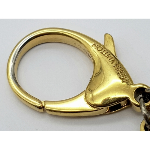 171 - A Louis Vuitton Bijoux Sac Tapage Charm/Key Ring. Gold and silver-toned hardware with iconic LV shap... 