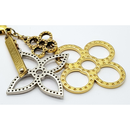 171 - A Louis Vuitton Bijoux Sac Tapage Charm/Key Ring. Gold and silver-toned hardware with iconic LV shap... 