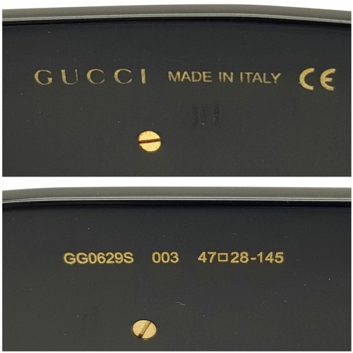 192 - A Pair of Gucci Black Round Sunglasses. Gold-toned GG logos to sides. Thick frames. Comes with case ... 