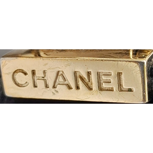 20 - A Chanel Black Boy Bag. Quilted leather exterior with gold-toned hardware, chain and leather adjusta... 