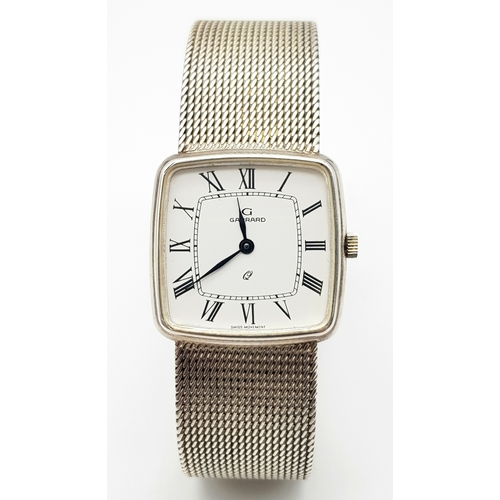 213 - A Rare Garrard Sterling Silver Gents Quartz Watch. Sterling silver bracelet and case - 29mm. White d... 