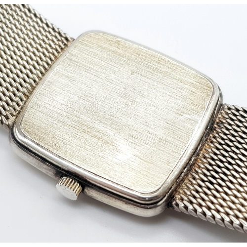 213 - A Rare Garrard Sterling Silver Gents Quartz Watch. Sterling silver bracelet and case - 29mm. White d... 