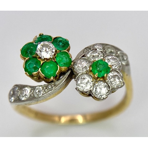 32 - A Vintage 18K Yellow Gold, Platinum, Emerald and Diamond Crossover Ring. Reverse flowers with emeral... 