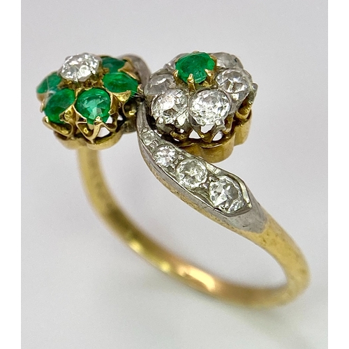 32 - A Vintage 18K Yellow Gold, Platinum, Emerald and Diamond Crossover Ring. Reverse flowers with emeral... 