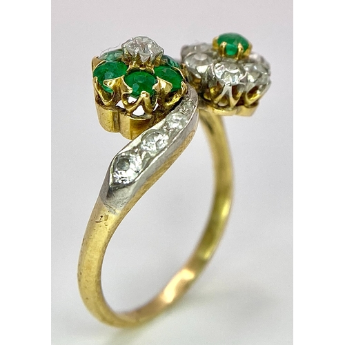 32 - A Vintage 18K Yellow Gold, Platinum, Emerald and Diamond Crossover Ring. Reverse flowers with emeral... 