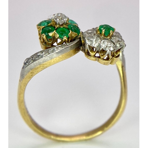 32 - A Vintage 18K Yellow Gold, Platinum, Emerald and Diamond Crossover Ring. Reverse flowers with emeral... 