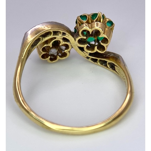 32 - A Vintage 18K Yellow Gold, Platinum, Emerald and Diamond Crossover Ring. Reverse flowers with emeral... 