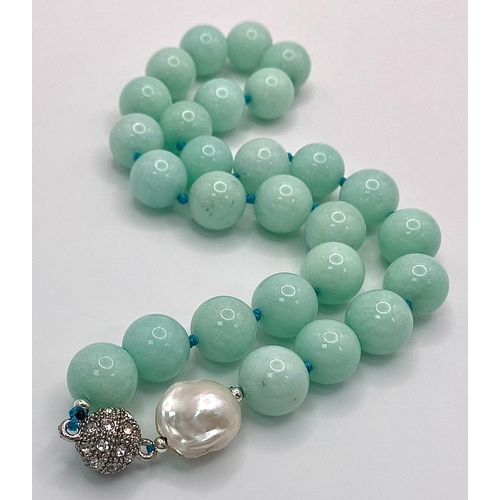 324 - A Large Beaded Amazonite Necklace with a Keisha Baroque Pearl Interrupter. 14mm beads. Necklace leng... 