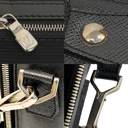 48 - A Louis Vuitton Black Business Bag. Leather exterior with silver-toned hardware, zipped compartment ... 