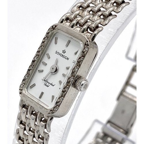 491 - A 9K White Gold Sovereign Quartz Watch. 9K gold bracelet and case - 13mm. White dial. Diamond bezel.... 