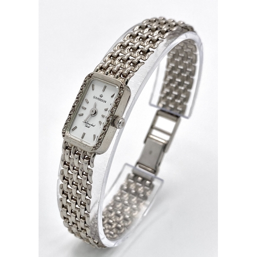 491 - A 9K White Gold Sovereign Quartz Watch. 9K gold bracelet and case - 13mm. White dial. Diamond bezel.... 