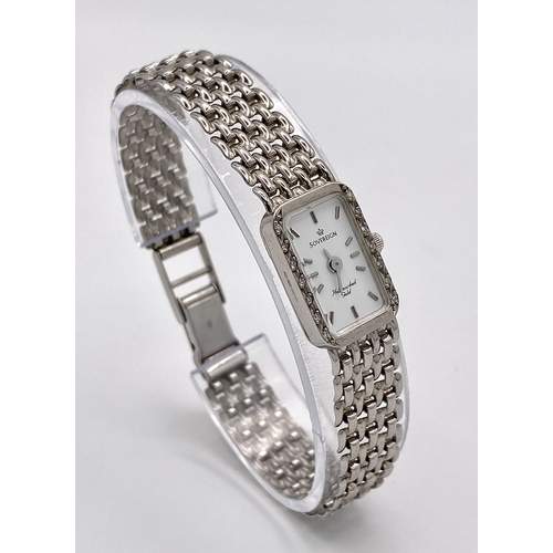 491 - A 9K White Gold Sovereign Quartz Watch. 9K gold bracelet and case - 13mm. White dial. Diamond bezel.... 