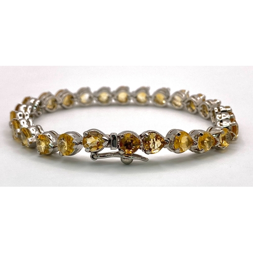 638 - A Citrine Heart-Cut Tennis Bracelet. Set in 925 Sterling silver. 34ctw. 19cm. HV2164