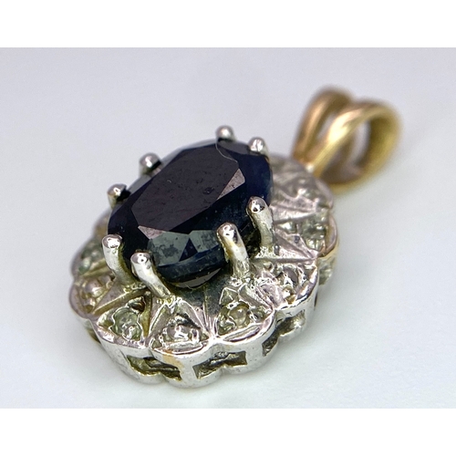 639 - A 9K Yellow and White Gold Sapphire and Diamond Pendant. 
2cm. 1.84g total weight