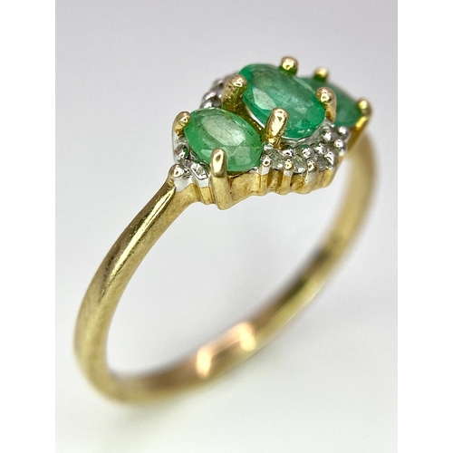 640 - A 9K Yellow Gold 3 Stone Emerald and Diamonds Ring. Size M, 1.8g total weight.