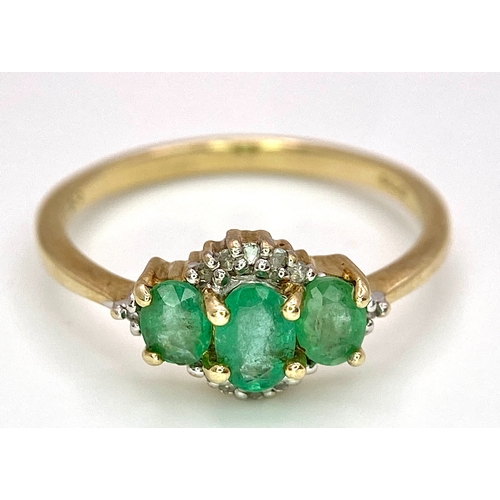 640 - A 9K Yellow Gold 3 Stone Emerald and Diamonds Ring. Size M, 1.8g total weight.