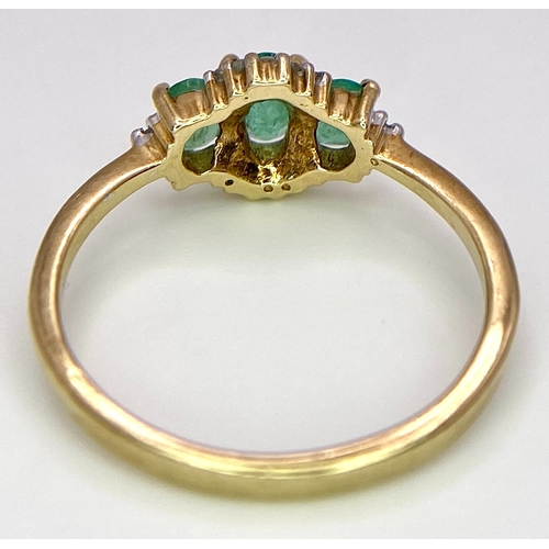 640 - A 9K Yellow Gold 3 Stone Emerald and Diamonds Ring. Size M, 1.8g total weight.