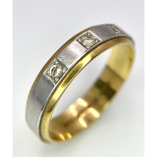 652 - An 18K Yellow and White Gild Three Diamond Band Ring. 0.10ctw diamonds. Size O. 5.2g weight.