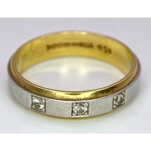 652 - An 18K Yellow and White Gild Three Diamond Band Ring. 0.10ctw diamonds. Size O. 5.2g weight.