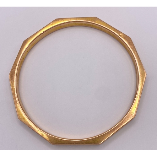 659 - A Vintage 9K Rose Gold Decagon Bangle. 7.5cm inner diameter. 14g weight.