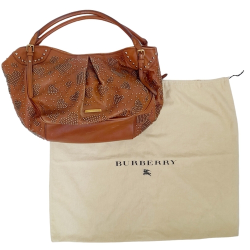 67 - A Burberry Tan Studded Heart Hobo Bag. Leather exterior with stud embellishments, golden-toned hardw... 