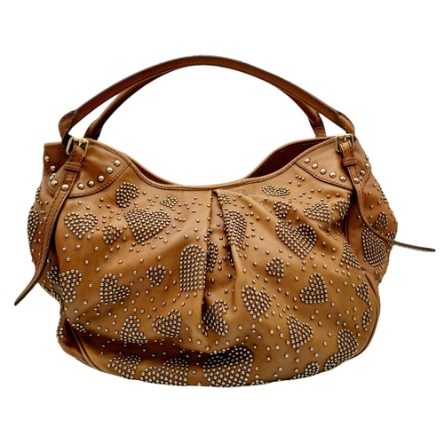 67 - A Burberry Tan Studded Heart Hobo Bag. Leather exterior with stud embellishments, golden-toned hardw... 