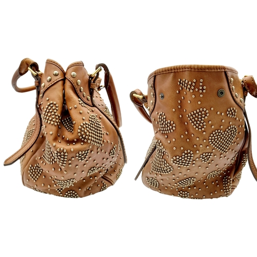 67 - A Burberry Tan Studded Heart Hobo Bag. Leather exterior with stud embellishments, golden-toned hardw... 