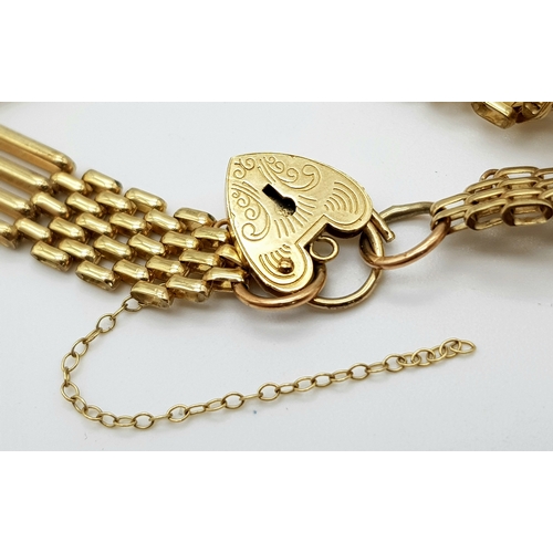 85 - A 9K Yellow Gold Gate Bracelet with Heart Clasp. 16cm. 10g