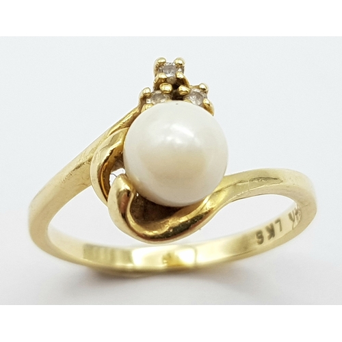 87 - A Vintage 14K Yellow Gold Pearl and Diamond Crossover Ring. Size M. 2.65g total weight.