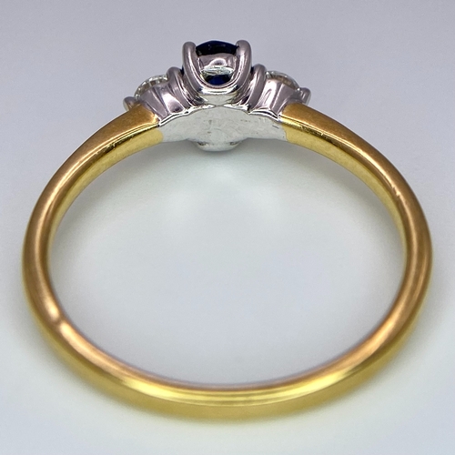 130 - AN 18K YELLOW GOLD DIAMOND AND SAPPHIRE 3 STONE RING. 0.50CT. OVAL BLUE SAPPHIRE. 2.5G. SIZE N