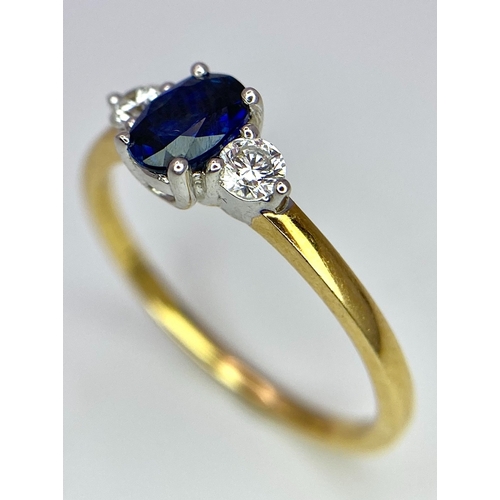 130 - AN 18K YELLOW GOLD DIAMOND AND SAPPHIRE 3 STONE RING. 0.50CT. OVAL BLUE SAPPHIRE. 2.5G. SIZE N