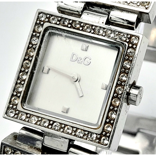 174 - The very iconic ladies DOLCE & GABBANA watch with the D & G logo studded in Swarovski crystals. Rect... 