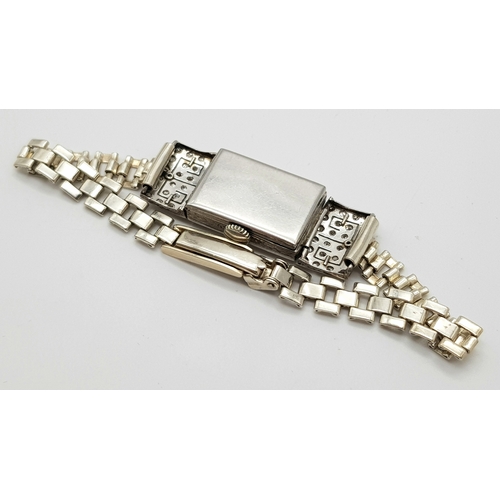 352 - An Antique Art Deco Platinum and Diamond Ladies Watch. Note: Original bracelet has been replace with... 