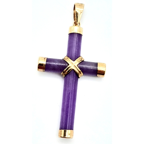 381 - A 9K Yellow Gold Amethyst Cross Pendant. 4.9cm length, 2.3g total weight.