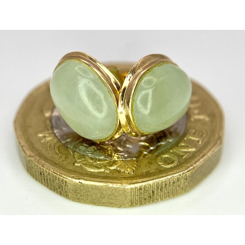 388 - A Pair of 9K Yellow Gold and Jade Stud Earrings. 1cm length, 1.5g total weight.