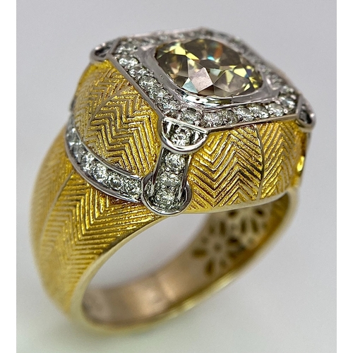 393 - An 18K Yellow Gold Diamond Dress Ring. A 2.5ct central globular cut yellow diamond, with a round cut... 