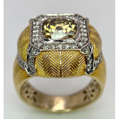 393 - An 18K Yellow Gold Diamond Dress Ring. A 2.5ct central globular cut yellow diamond, with a round cut... 