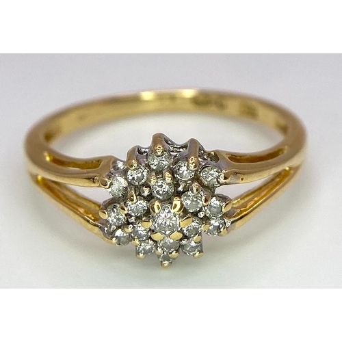 444 - An 18K Yellow Gold Diamond Cluster Ring. 0.25ctw diamonds. Size N. 2.6g total weight.