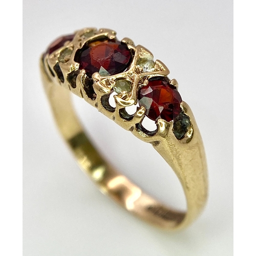 647 - A 9K Yellow Gold, Garnet and Diamond Ring. Size K, 1.9g total weight. Comes in presentation case.