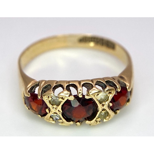 647 - A 9K Yellow Gold, Garnet and Diamond Ring. Size K, 1.9g total weight. Comes in presentation case.