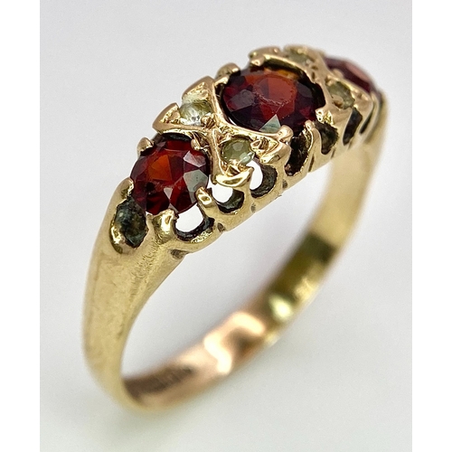 647 - A 9K Yellow Gold, Garnet and Diamond Ring. Size K, 1.9g total weight. Comes in presentation case.