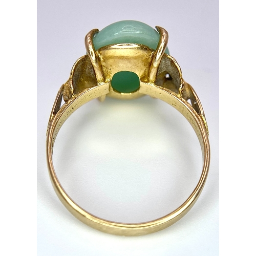 682 - A 9K Yellow Gold Jade Cabochon Ring. 1.8cm jade. Size L, 3.1g total weight.